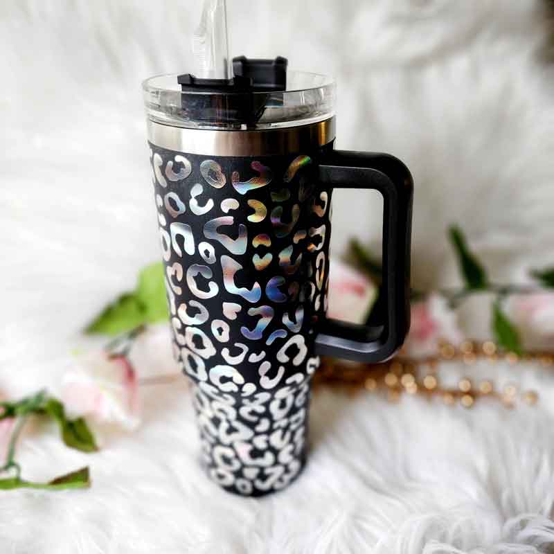 40 oz stainless steel tumbler with handle. Black with leopard print design.