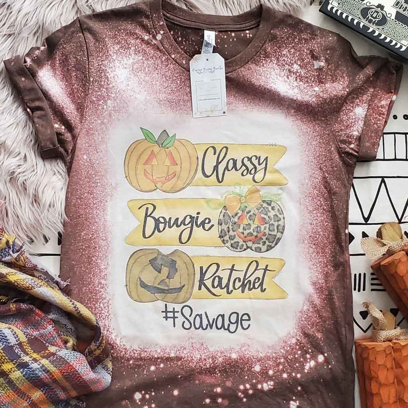 Brown bleached style tee with Halloween theme "classy, bougie, ratchet, #savage" saying and different style pumpkins.