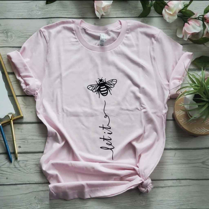 Light pink color tee with quote "Let it be"  and bee image.