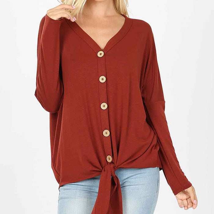 Plus size dark rust color button long sleeve top with tie at bottom.