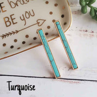 Turquoise color marble bar shape earrings.