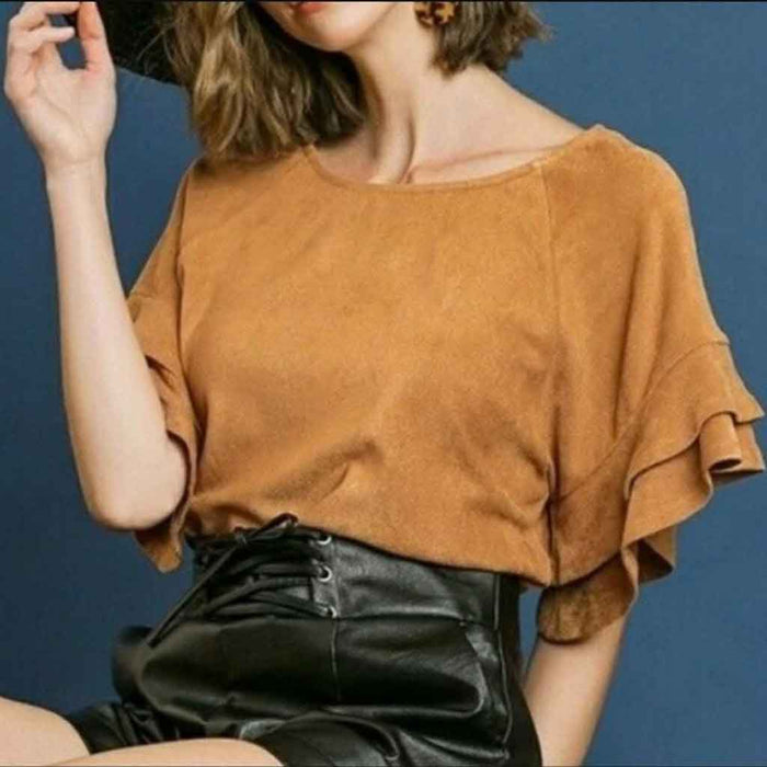 Umgee brand suede style top with ruffled sleeves.